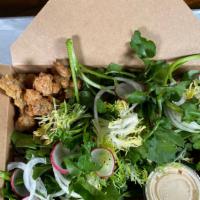 Fried Chicken Salad · Watercress, fresh herbs, popcorn chicken, buttermilk and black garlic dressing.