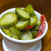 Pickles · Persian cucumber, Thai chili, and garlic