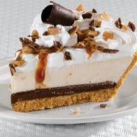 Heath® Crunch Cheesecake Pie · A caramel toffee cheesecake topped with real whipped cream, crushed Heath® bar and chocolate...