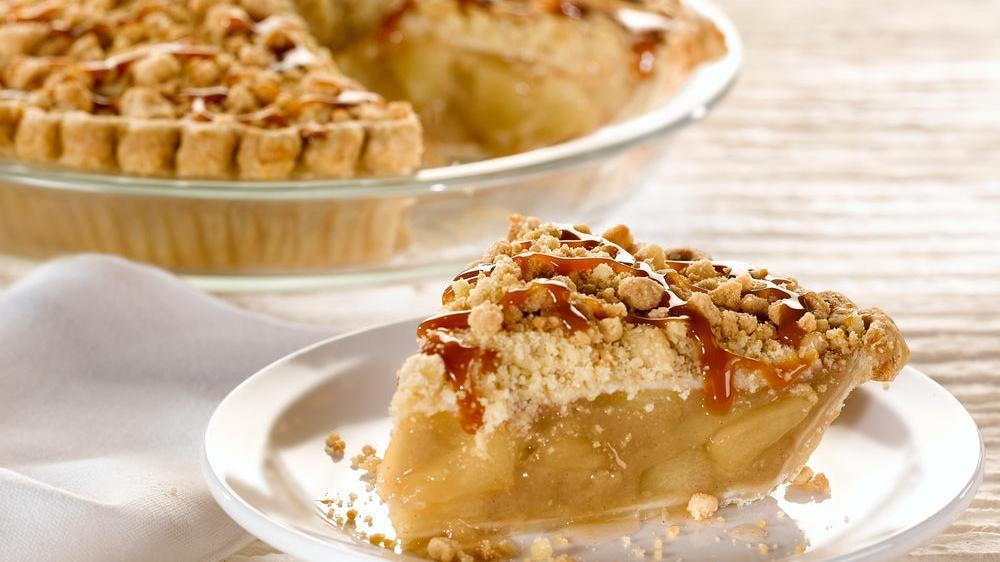 Caramel Apple Pie, Slice · Luscious apples with a crumb topping and rich caramel icing. (500 cal/slice).