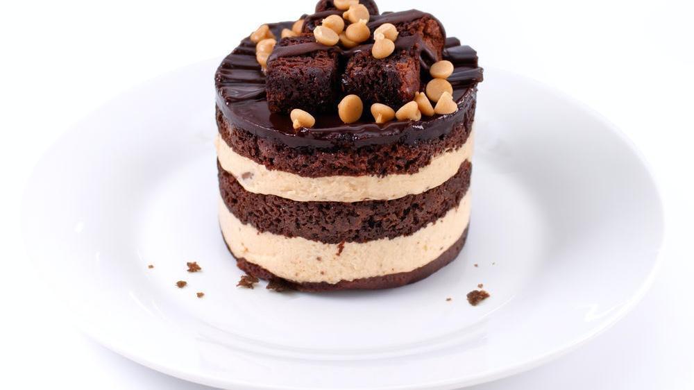 New! Chocolate Peanut Butter Drop · A dynamite combination of fudge brownies, velvety smooth peanut butter mousse and chocolate cake is topped with brownie chunks and peanut butter chips. (710 Cal)