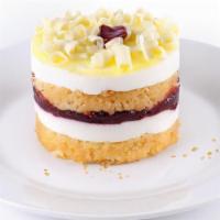 New! Raspberry Lemon Drop · Light & refreshing! Yellow sponge cake is layered with lemon mousse and thick raspberry pres...