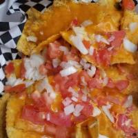 Btb Nachos · Topped with tomatoes, onions, jalapeños, Cheddar or nacho and mozzarella cheeses. Served wit...
