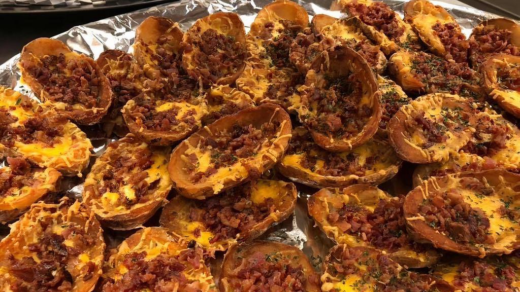 Potato Skins · Covered in Cheddar, mozzarella cheese and crispy bacon served with a side of sour cream. Make them loaded with tomato, onion and meat hot for an additional charge.