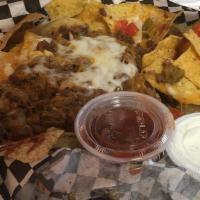 Huge Loaded Nachos · The same as our regular nachos but oh so much more! Add chicken, beef, or pork for an additi...