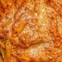 Penne Alla Vodka · Penne pasta baked with our alla vodka sauce topped with parmesan cheese