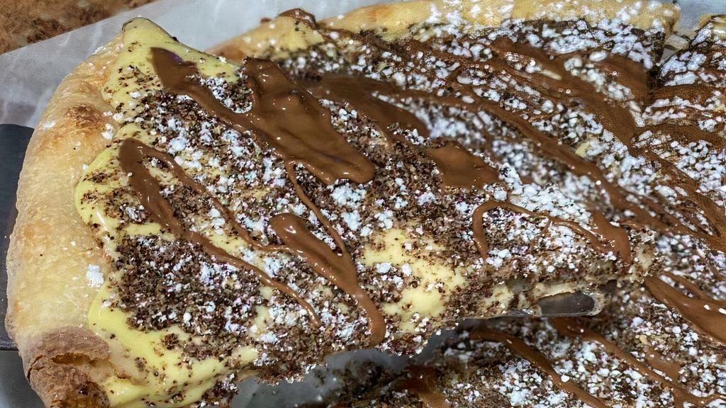 Cookies & Cream Pie · Sweet dough baked with our secret sauce, topped with cookie crumbs and a drizzle of swiss milk chocolate