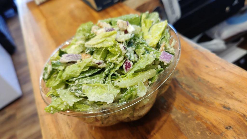 Caesar Salad · Lettuce, parmesan cheese, red onions, croutons, and caesar dressing