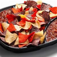 Chips & Salsa · Fried, tri-color tortilla chips lightly salted and served with our House Made Salsa. Tray ac...