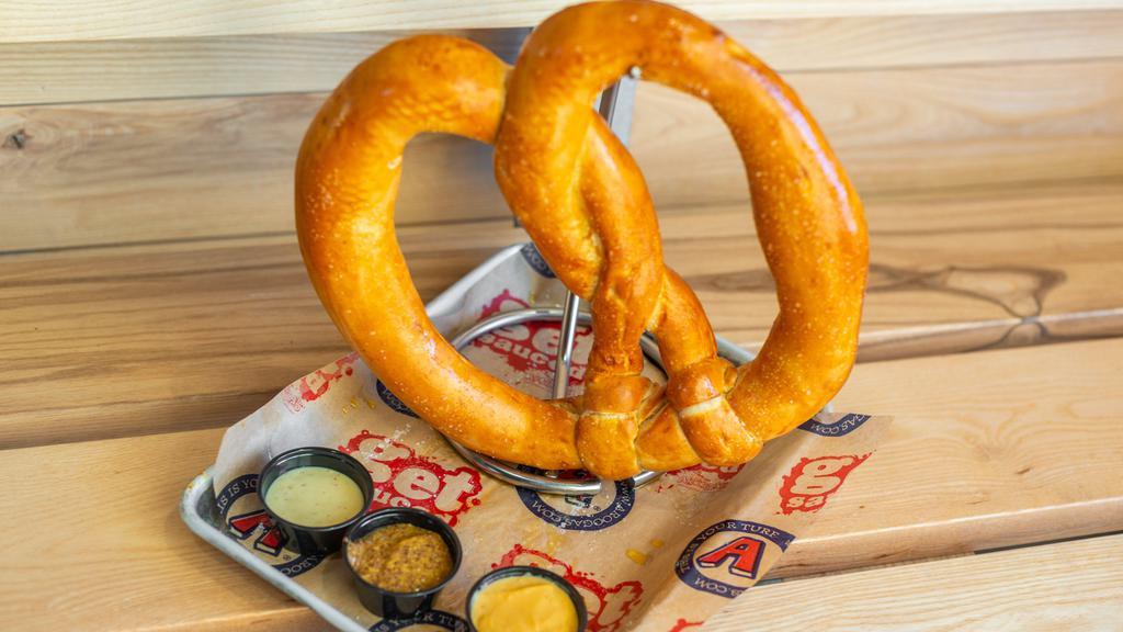 The B.I.G. Pretzel · Notoriously BIG scratch-made pretzel, kosher salt, Fat Tire beer cheese, Bavarian mustard, honey mustard