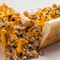 Chicken Cheesesteak · No antibiotic ever chicken, Cheez Whiz or white cheese sauce, caramelized onion, Amoroso's h...