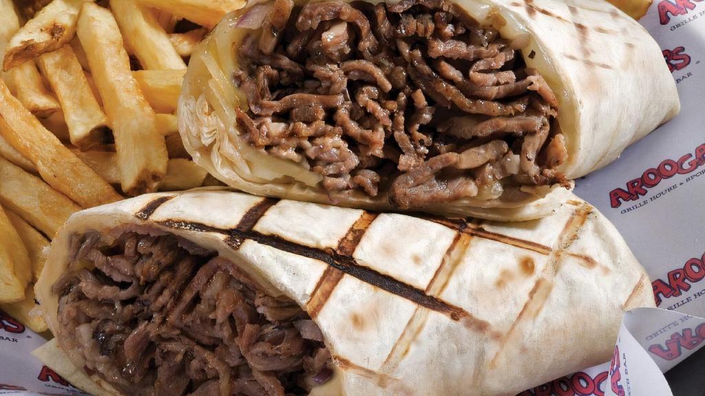 Philly Cheesesteak Wrap · Ribeye, Cheez Whiz or white cheese sauce, caramelized onion, white or what wrap