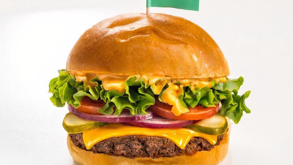 Impossible Burger · ** Gluten Free Option Available **. Plant-based burger, American cheese, green leaf lettuce, tomato, red onion, pickle, burger sauce