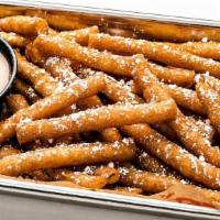 Funnel Cake Fries · Fry-shaped funnel cakes, powdered sugar, cinnamon sauce