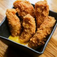 Buttermilk Chicken Tenders · Honey mustard dip.