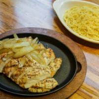 Grilled Chicken Steak · Free-ranged chicken breast and sauteed onions.