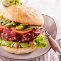 California Burger · Juicy beef patty with creamy avocado, Swiss cheese and ranch dressing, served on a soft bun ...