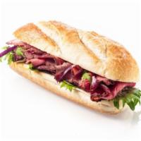 Philly-Style Beef Steak Sandwich · Delicious sandwich with sliced beef, sautéed green pepper, onion and tomato on your choice o...