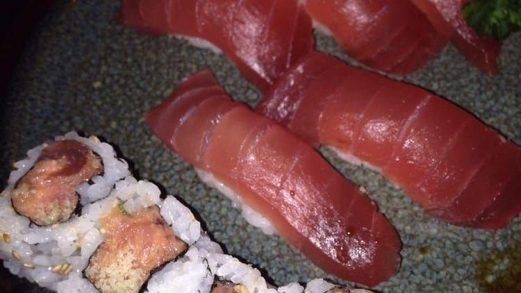 Mt. Fuji Roll · Spicy tuna with crunch and avocado rolled with whole white tuna on the top. Raw.