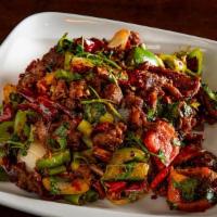 Cumin Gf · Cumin crusted & cooked with bell peppers, onions and cilantro. Spicy