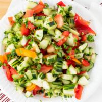 Israeli Salad · Diced cucumbers tomatoes and peppers in a light dressing