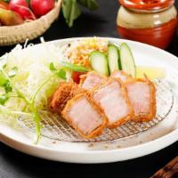Tonkatsu Bento (Pork Loin) · 8 oz., 180 gm. Berkshire pork  Loin served with shredded cabbage, tomato, cucumber, White ri...