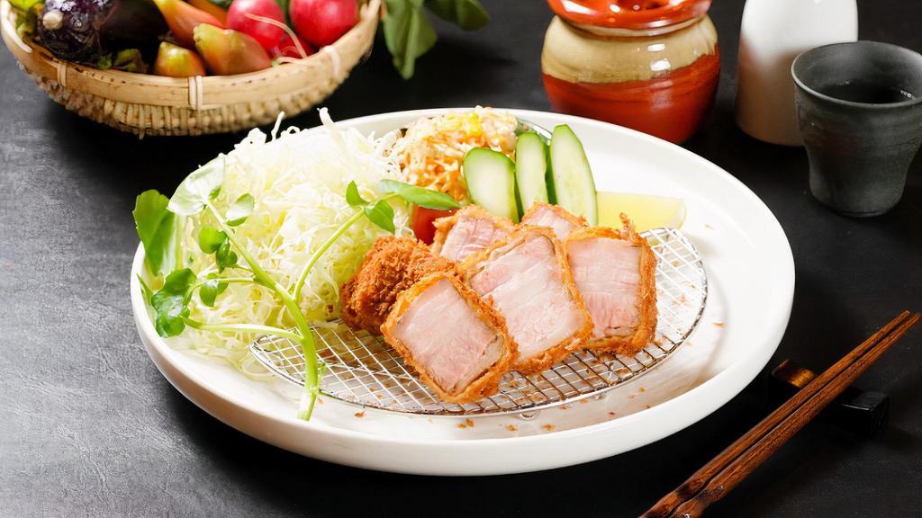 Tonkatsu Bento (Pork Loin) · 8 oz., 180 gm. Berkshire pork  Loin served with shredded cabbage, tomato, cucumber, White rice and pickles