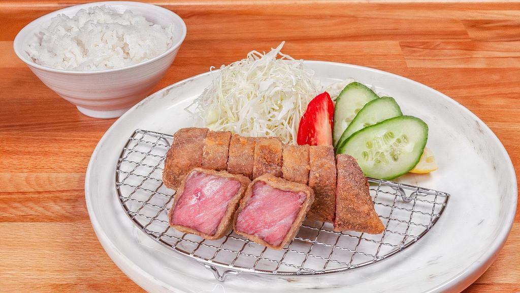 Beef Katsu Bento (Us Wagyu Sirloin) · 8 oz., 180 gm. US Wagyu Beef Sirloin served with shredded cabbage, tomato, cucumber, White rice and pickles
