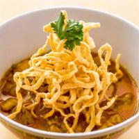 Khao Soi · Red curry, coconut milk, chicken, egg, noodles, pickled mustard greens, red onions