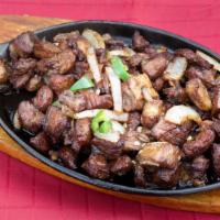 Lega Tibs · Tender cubes from the leg of a lamb marinated in white wine and kibe then sautéed to perfect...