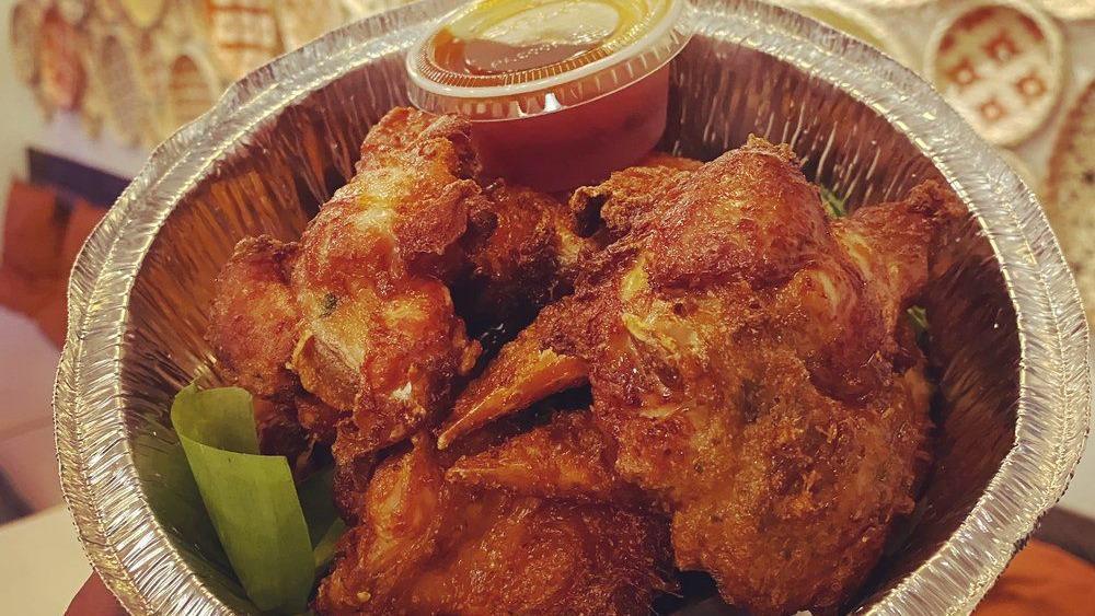 Yoongkao Home Style Wings · Marinated chicken wings with Grandma's Thai herb blend recipe served with spicy tamarind sauce.