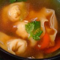 Wonton Soup · Stuffed ground chicken and shrimp in clear broth.