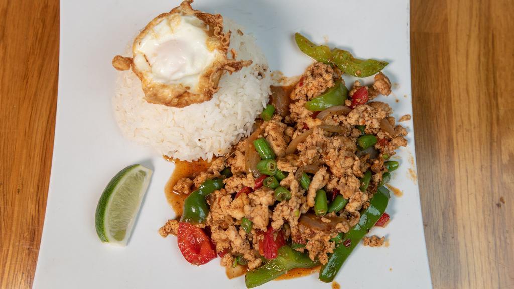 Dancing Chicken · Ground chicken, basil sauce, fried egg and rice.