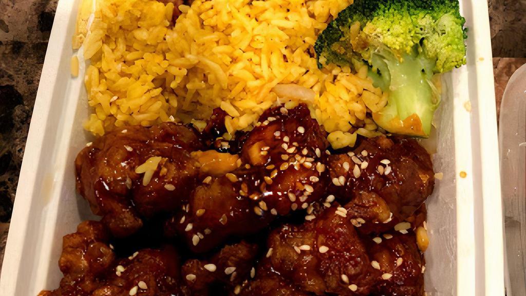  Sesame Chicken · All served with pork fried rice or white rice choice of wonton soup or egg drop soup or hot and sour soup or can soda or egg roll.