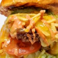 Colombiana Burger · Pink sauce, pineapple sauce, lettuce, tomatoes, potato sticks, melted house cheese blend.