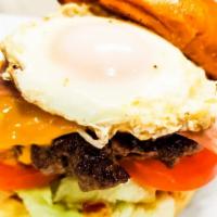 Brunch Burger · Ketchup, mustard, mayo, lettuce, tomatoes, onions, ham, fried egg, cheese.