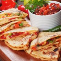 Roasted Vegetable Quesadilla · Delicious quesadilla with roasted red peppers, fresh zucchini, eggplant, tasty tomato, red o...