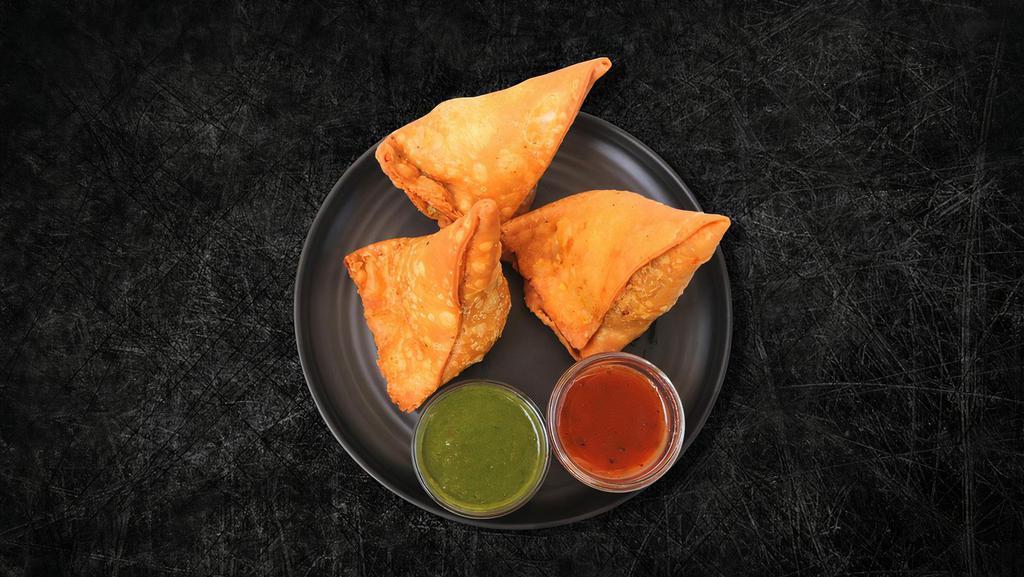 Samosa Delight (Vegan) (2 Pcs) · Flaky pastry dumplings filled with spiced potatoes, vegetables and deep-fried till crisp and golden