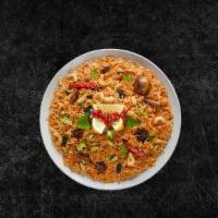 Veggie Delight Biryani (Vegan) · Long grained basmati rice flavored with fragrant spices & saffron, layered with vegetables c...