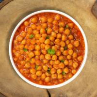 Chana Masala Collision  · Chickpeas cooked in a tomato and onion gravy with Indian spices.