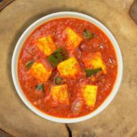Kadai Kick Paneer · Tender cottage cheese pieces stir fried with bell peppers, onions, & tomatoes in a light gra...