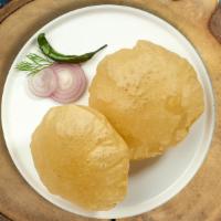 Pretty Poori  · Deep fried Indian bread cooked until golden crisp. Two pieces.