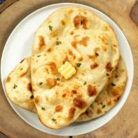 Back To Butter Naan · Freshly baked bread in a clay oven.