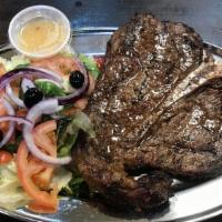 T-Bone Steak · Served with two choices rice, beans, french fries, salad or vegetables, just two choices.