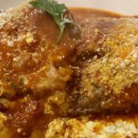 Eggplant Rollatini · Served with pasta.