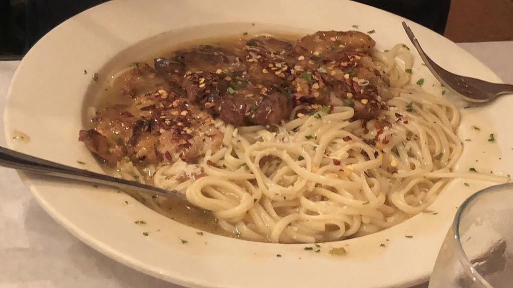 Veal Piccata · Served with bread salad and pasta.