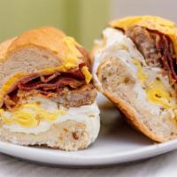 The Hungry Man · 3 eggs, bacon, sausage, ham and cheese. Served with choice of small coffee, tea or 8 oz water.