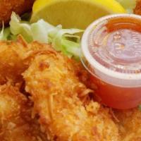 Coconut Shrimp · 8 pieces. Panko and coconut crusted shrimp with sweet thai chili sauce.