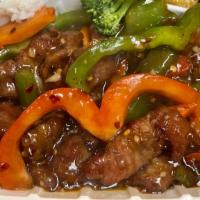 Mongolian Beef · Spicy. Stir fry marinated beef strips with red & green bell peppers and carrots.