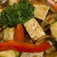 Tofu Stir Fry · Tofu, zucchini, mushrooms, carrots, onion, broccoli, served with soy sauce and rice.